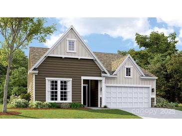New construction two-story home with attached two-car garage, and a manicured lawn with landscape at 6400 Fairfax Ct, Maiden, NC 28650