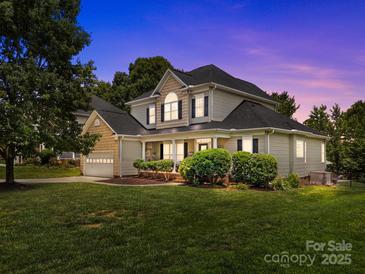 Charming two-story home with a well-manicured lawn and inviting front porch at 191 Harris Farm Rd, Mooresville, NC 28115