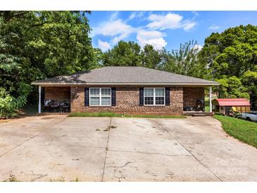 Charming single-story brick home with a spacious driveway and classic black shutters at 508 Gantt St # 1-2, Kings Mountain, NC 28086