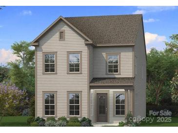 Charming two-story home with symmetrical windows and a covered front porch, set in a landscaped yard at 3111 Middle St # 93, Charlotte, NC 28278
