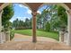 Serene backyard with a view of the lake, lush lawn, and stone pathway at 18019 Harbor Light Blvd, Cornelius, NC 28031