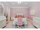 Serene bedroom with lavender wallpaper and a white vanity at 18019 Harbor Light Blvd, Cornelius, NC 28031