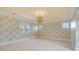 Charming bedroom with floral wallpaper, arched windows, and plush carpeting at 18019 Harbor Light Blvd, Cornelius, NC 28031