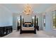 Main bedroom with natural light, chandelier, and luxury furniture at 18019 Harbor Light Blvd, Cornelius, NC 28031