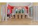 Formal dining room with red walls, large table and chandelier at 18019 Harbor Light Blvd, Cornelius, NC 28031