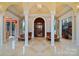 Spacious entryway with high ceilings, columns, and elegant lighting at 18019 Harbor Light Blvd, Cornelius, NC 28031