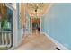 Bright hallway with tiled floor, transom windows, and chandelier lighting at 18019 Harbor Light Blvd, Cornelius, NC 28031