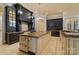 Well appointed kitchen with custom cabinets, stone countertops, and stainless steel appliances at 18019 Harbor Light Blvd, Cornelius, NC 28031