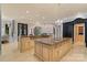 Luxury kitchen with stone countertops, dual islands, stainless appliances, and custom cabinetry at 18019 Harbor Light Blvd, Cornelius, NC 28031