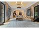 Inviting living room with high ceilings, decorative columns, and access to outdoor spaces at 18019 Harbor Light Blvd, Cornelius, NC 28031