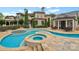 Luxury pool and spa area with stone patio and outdoor seating at 18019 Harbor Light Blvd, Cornelius, NC 28031