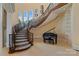 Elegant curved staircase with ornate railing and grand piano at 18019 Harbor Light Blvd, Cornelius, NC 28031