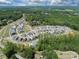 An aerial view of the beautiful new home community surrounded by mature trees at 11318 James Coy Rd # Devonshire, Davidson, NC 28036
