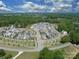 An aerial view of the beautiful new home community surrounded by mature trees at 11318 James Coy Rd # Devonshire, Davidson, NC 28036