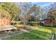 Backyard with grassy area, shed, and walkway at 3726 The Plaza None, Charlotte, NC 28205