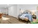 Cozy bedroom with a queen-size bed and light wood floors at 3726 The Plaza None, Charlotte, NC 28205