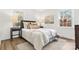 Cozy bedroom with neutral decor and hardwood flooring at 3726 The Plaza None, Charlotte, NC 28205