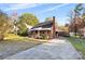 House's exterior showing front yard, driveway, and landscaping at 3726 The Plaza None, Charlotte, NC 28205