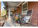 Front porch with rocking chairs, plants, and awning at 3726 The Plaza None, Charlotte, NC 28205