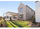 Landscaped backyard with covered patio, a cozy retreat for outdoor enjoyment at 8159 Fairview Rd, Charlotte, NC 28226