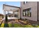 Backyard featuring a covered patio, lush green grass, and lovely landscaping at 8159 Fairview Rd, Charlotte, NC 28226