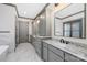 Modern bathroom with double vanities, marble countertops, and stylish fixtures at 8159 Fairview Rd, Charlotte, NC 28226