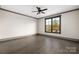 Bright bedroom with a window offering natural light and hardwood flooring at 8159 Fairview Rd, Charlotte, NC 28226