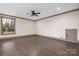 Spacious bedroom with hardwood floors and a large window at 8159 Fairview Rd, Charlotte, NC 28226
