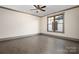 Large bedroom featuring a ceiling fan and hardwood flooring throughout at 8159 Fairview Rd, Charlotte, NC 28226