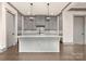 Stylish kitchen with a large island, stainless steel appliances, and pendant lighting at 8159 Fairview Rd, Charlotte, NC 28226