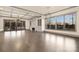 Bright living area with a fireplace, large windows, and hardwood flooring at 8159 Fairview Rd, Charlotte, NC 28226
