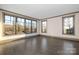 Bright living room with hardwood floors and large windows, showcasing natural light at 8159 Fairview Rd, Charlotte, NC 28226