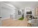 Spacious bonus room with golf simulator, comfortable seating, and stylish decor, perfect for relaxation and recreation at 8163 Fairview Rd, Charlotte, NC 28226