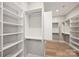 Spacious walk-in closet with custom shelving, hanging rods, and ample storage space for an organized wardrobe at 8163 Fairview Rd, Charlotte, NC 28226