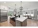 Open-concept kitchen, dining, and living areas offering an ideal space for modern living and entertaining at 8163 Fairview Rd, Charlotte, NC 28226