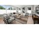 Bright living room with comfortable seating, stylish decor, large windows, and ample space for relaxation and entertaining at 8163 Fairview Rd, Charlotte, NC 28226