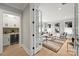 Elegant living room with modern decor, wet bar, built-in storage, and stylish accents, perfect for entertaining guests at 8163 Fairview Rd, Charlotte, NC 28226