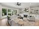 Comfortable living room featuring a fireplace, built-in shelves, and a sliding glass door to the backyard at 8163 Fairview Rd, Charlotte, NC 28226