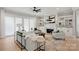 Inviting living room featuring a fireplace, built-in shelves, and comfortable seating arrangement at 8163 Fairview Rd, Charlotte, NC 28226