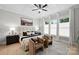 Cozy main bedroom featuring three bright windows and a queen size bed with neutral-colored linens at 8163 Fairview Rd, Charlotte, NC 28226