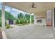 Covered patio featuring a brick fireplace, providing an ideal setting for outdoor gatherings and relaxation at 8163 Fairview Rd, Charlotte, NC 28226