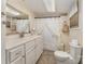 Cozy bathroom with white vanity, decorative shower curtain, and patterned tile floor at 225 Shore Acres Rd, Salisbury, NC 28146