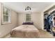 Simple bedroom with a cozy bed and natural light from a window at 225 Shore Acres Rd, Salisbury, NC 28146