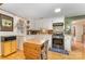 Well-lit kitchen with white cabinets, black range, and colorful tiled backsplash at 225 Shore Acres Rd, Salisbury, NC 28146