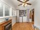 Convenient laundry room with washer, dryer, shelving, and a ceiling fan at 225 Shore Acres Rd, Salisbury, NC 28146