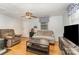 Cozy living room with a ceiling fan, comfortable seating, and natural light from the window at 225 Shore Acres Rd, Salisbury, NC 28146