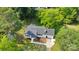 Aerial view of a charming single-story home with a well-maintained yard and mature trees at 506 E Maine Ave, Bessemer City, NC 28016