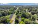 Overhead view of neighborhood with lush trees lining streets and single Gathering homes with private driveways at 506 E Maine Ave, Bessemer City, NC 28016
