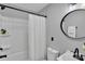 Modern bathroom featuring a shower-tub combo and elegant fixtures at 506 E Maine Ave, Bessemer City, NC 28016