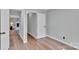 Empty bedroom with hardwood floors and a view of a fireplace at 506 E Maine Ave, Bessemer City, NC 28016